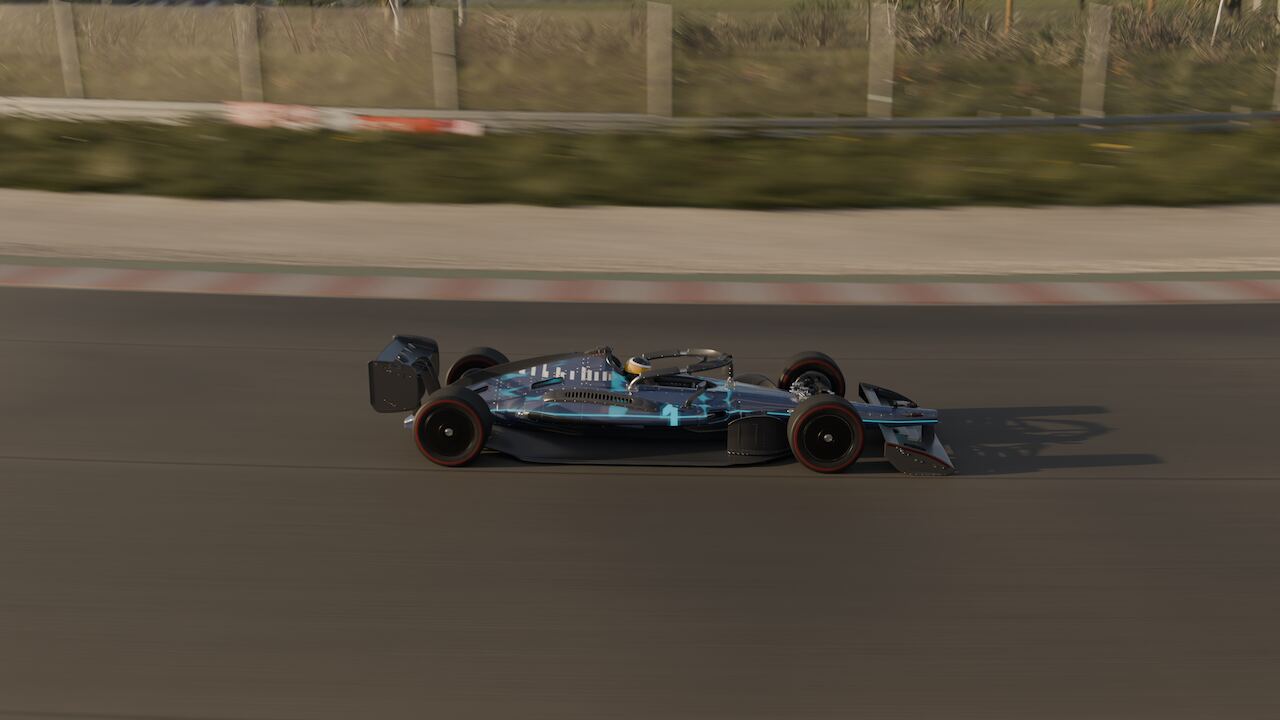 Kerb-height view alongside the car as it runs through a corner, red and white kerb streaking past.